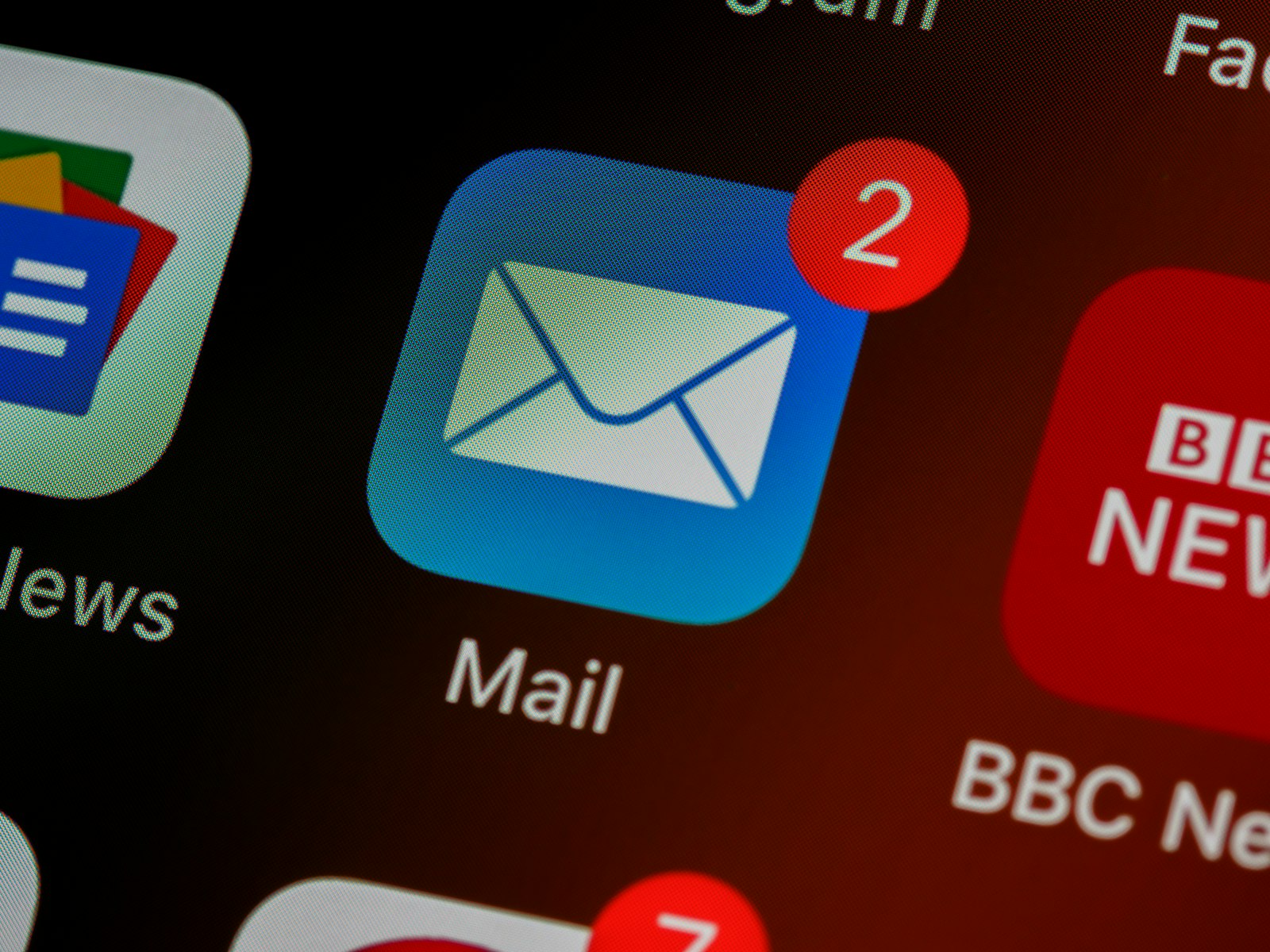 Close-up of a mail app icon on a phone screen showing unread notifications