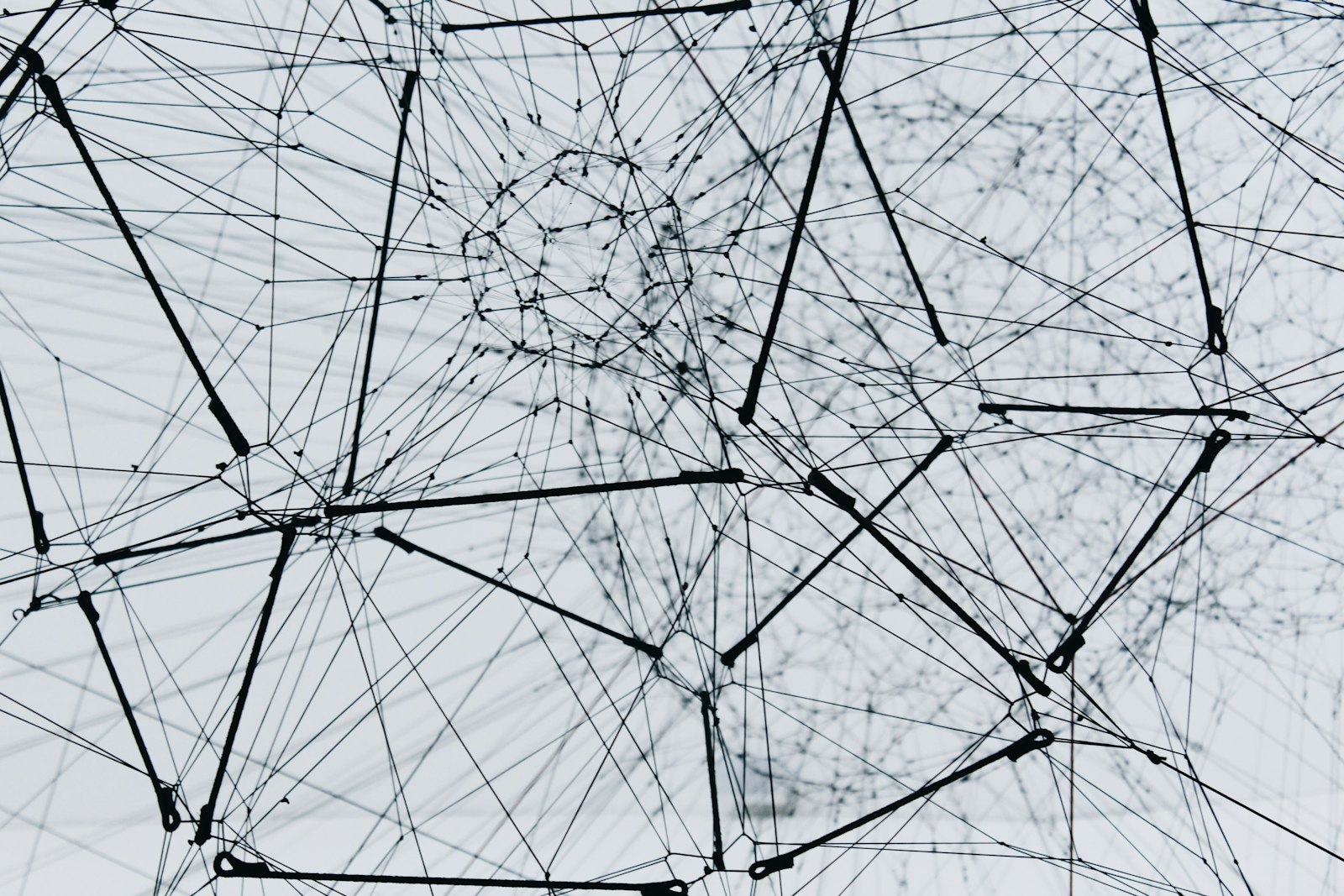 Abstract network of connected nodes and lines representing distributed data pathways